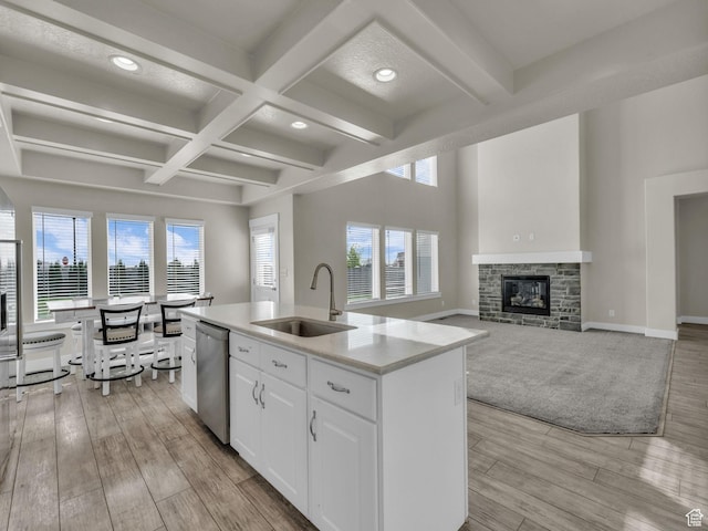 2562 E 80 S, Spanish Fork, UT 84660 - kitchen featuring white cabinets, a sink, dishwasher, a center island with sink, and coffered ceiling