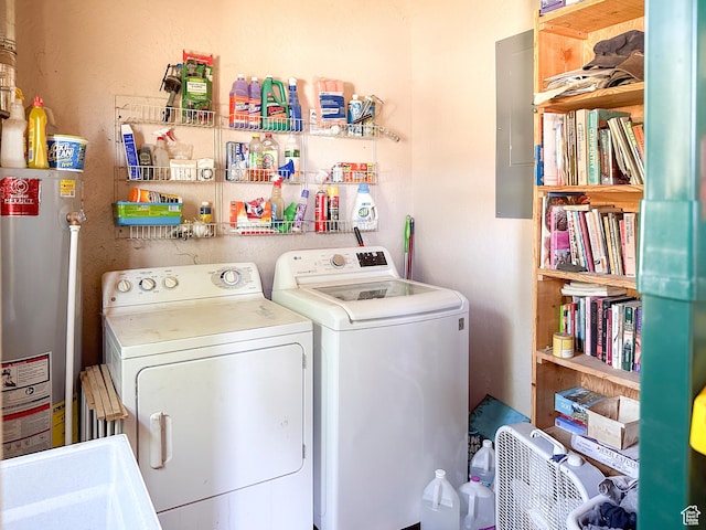 laundry room featuring independent washer and dryer, electric panel, and gas water heater