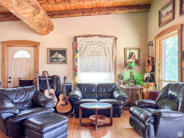 living room with wooden ceiling, beamed ceiling, and light wood-type flooring