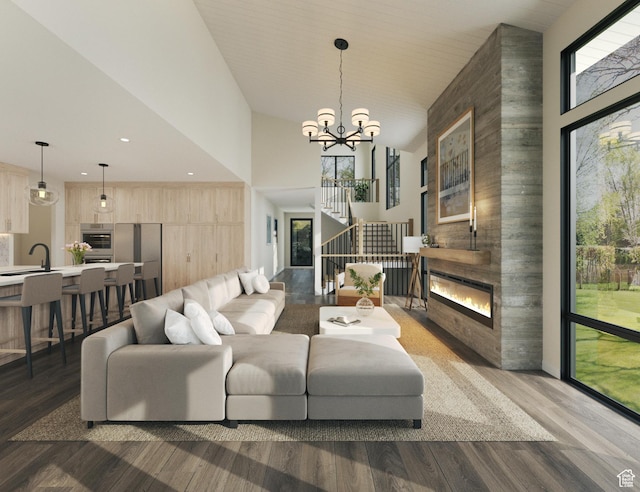 4044 W Crest Ct, Park City, UT 84098 - living room with healthy amount of natural light, a fireplace, a towering ceiling, wood finished floors, and recessed lighting