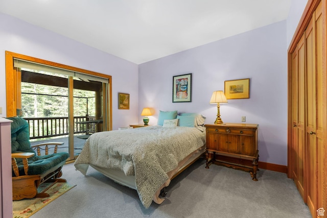 9443 E Wild Clematis Ln Unit 1, Brighton, UT 84121 - bedroom featuring access to outside, a closet, light colored carpet, and baseboards