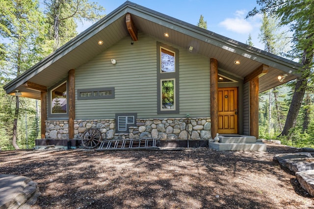 9443 E Wild Clematis Ln Unit 1, Brighton, UT 84121 - exterior space with entry steps and stone siding