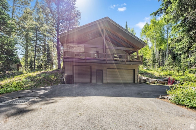 9443 E Wild Clematis Ln Unit 1, Brighton, UT 84121 - garage with aphalt driveway