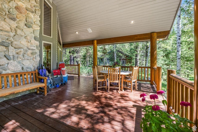 9443 E Wild Clematis Ln Unit 1, Brighton, UT 84121 - wooden terrace with outdoor dining area