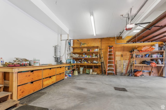 9443 E Wild Clematis Ln Unit 1, Brighton, UT 84121 - garage with a workshop area and a garage door opener