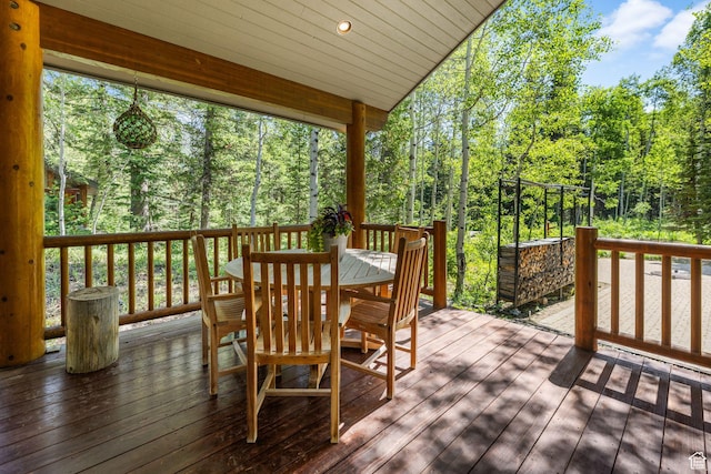 9443 E Wild Clematis Ln Unit 1, Brighton, UT 84121 - wooden terrace featuring outdoor dining space