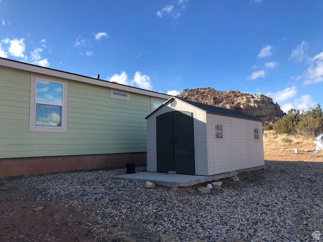 255 S 800 W, Escalante, UT 84726 - rear view of property with a mountain view and a storage unit