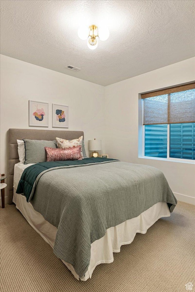 1901 S Sawmill Blvd E Unit 415, Heber City, UT 84032 - bedroom featuring carpet flooring and a textured ceiling