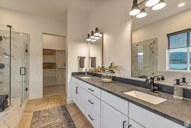 1901 S Sawmill Blvd E Unit 415, Heber City, UT 84032 - bathroom with hardwood / wood-style floors, vanity, and a shower with shower door