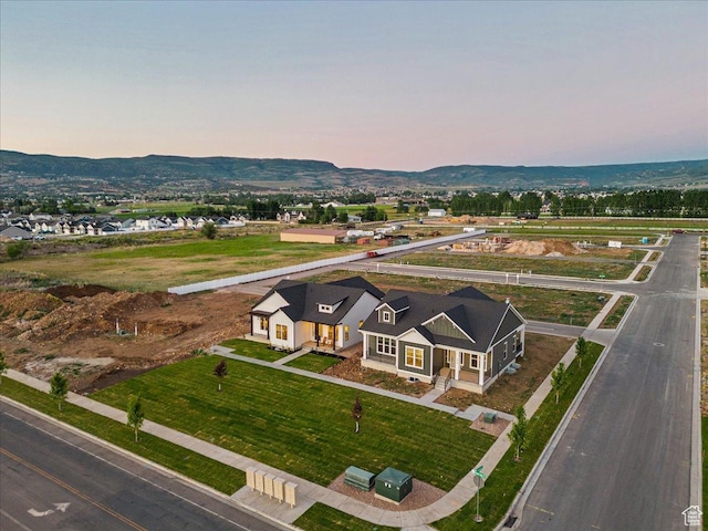 1901 S Sawmill Blvd E Unit 415, Heber City, UT 84032 - aerial view at dusk featuring a mountain view