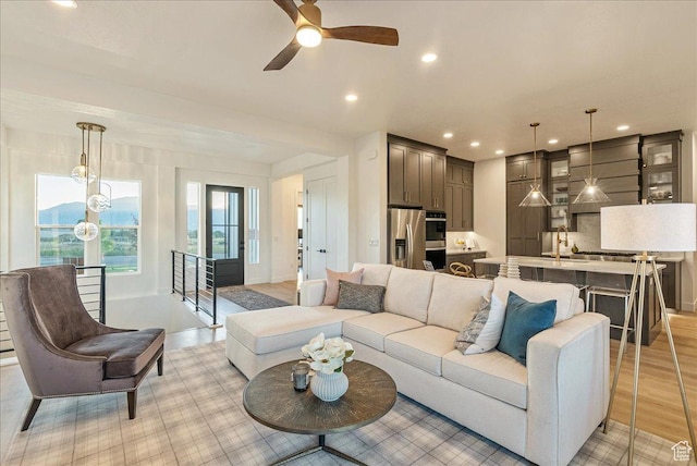 1901 S Sawmill Blvd E Unit 415, Heber City, UT 84032 - living room with ceiling fan, light wood-type flooring, and sink