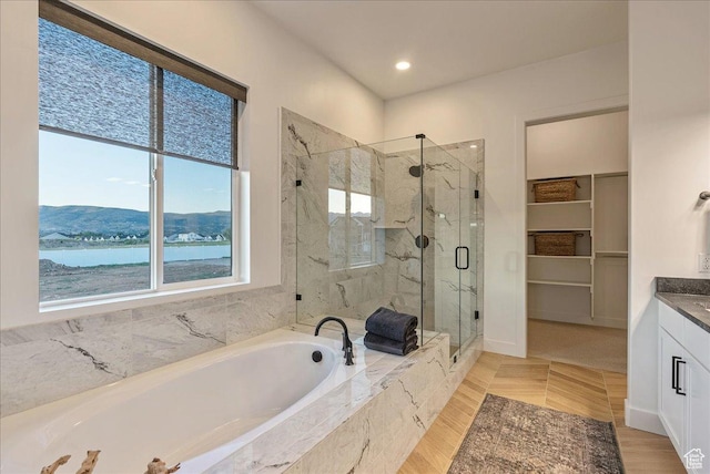 1901 S Sawmill Blvd E Unit 415, Heber City, UT 84032 - bathroom featuring a water and mountain view, vanity, and shower with separate bathtub