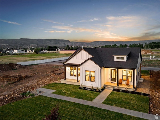 1901 S Sawmill Blvd E Unit 415, Heber City, UT 84032 - view of front of home featuring a mountain view, a yard, and a porch