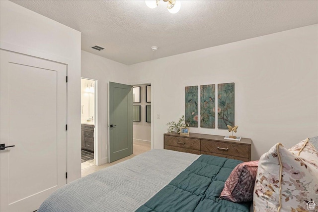 1901 S Sawmill Blvd E Unit 415, Heber City, UT 84032 - bedroom with a textured ceiling and ensuite bath