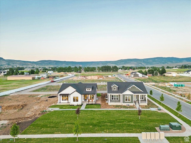 1901 S Sawmill Blvd E Unit 415, Heber City, UT 84032 - view of front facade featuring a mountain view, a yard, and covered porch