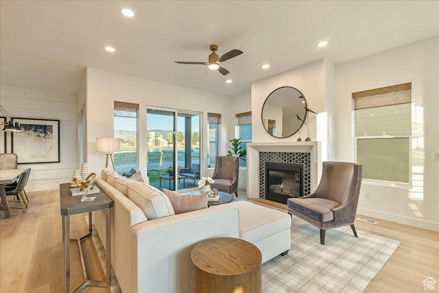 1901 S Sawmill Blvd E Unit 415, Heber City, UT 84032 - living room with ceiling fan, light wood-type flooring, and a tiled fireplace
