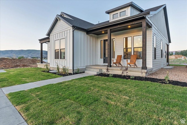 1901 S Sawmill Blvd E Unit 415, Heber City, UT 84032 - view of front of property featuring a mountain view, a porch, and a front yard