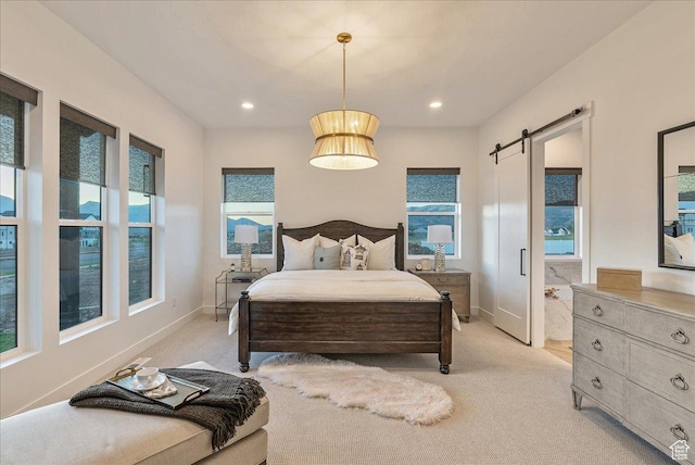 1901 S Sawmill Blvd E Unit 415, Heber City, UT 84032 - bedroom with a barn door and light colored carpet