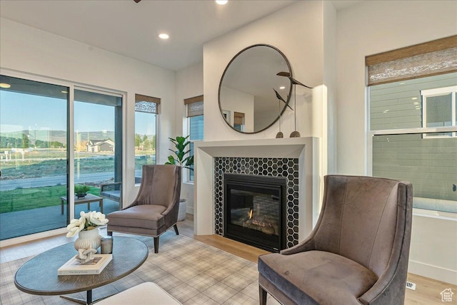 1901 S Sawmill Blvd E Unit 415, Heber City, UT 84032 - sitting room featuring light hardwood / wood-style floors and a tiled fireplace