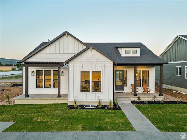 1901 S Sawmill Blvd E Unit 415, Heber City, UT 84032 - back house at dusk with a lawn