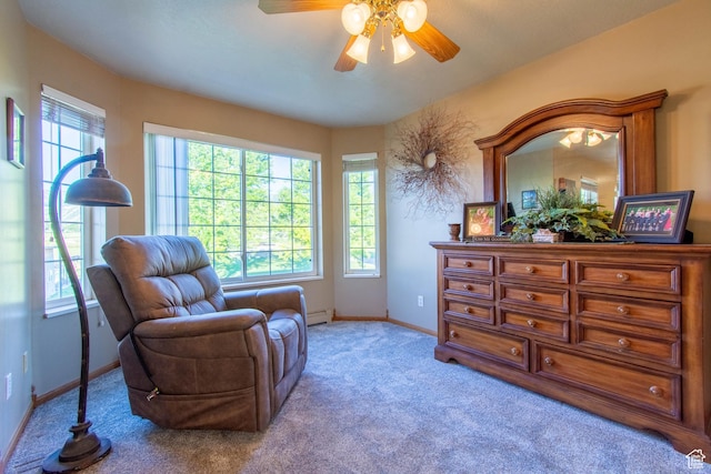 560 N 400 W, Smithfield, UT 84335 - living area with plenty of natural light, a ceiling fan, baseboards, and carpet