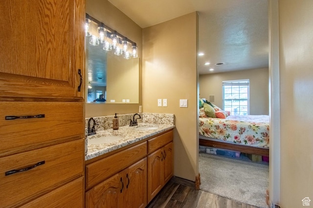 560 N 400 W, Smithfield, UT 84335 - full bath featuring wood finished floors, a sink, double vanity, and ensuite bathroom