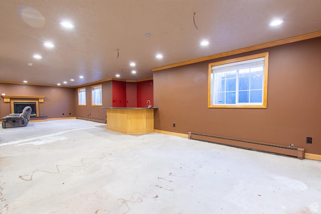 560 N 400 W, Smithfield, UT 84335 - unfurnished living room featuring ornamental molding, recessed lighting, a fireplace with raised hearth, and a baseboard radiator