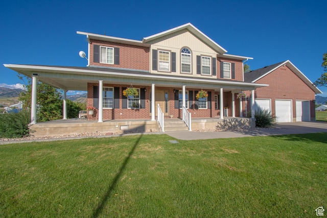 560 N 400 W, Smithfield, UT 84335 - view of front of home featuring covered porch, a front lawn, and brick siding