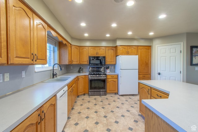 560 N 400 W, Smithfield, UT 84335 - kitchen featuring a sink, brown cabinets, white appliances, light countertops, and recessed lighting
