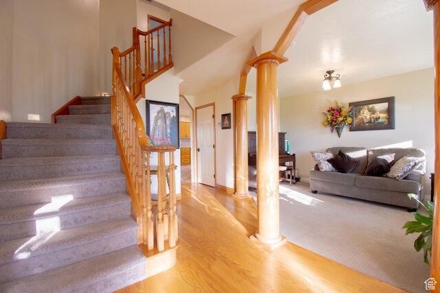 560 N 400 W, Smithfield, UT 84335 - stairs with baseboards, wood finished floors, and ornate columns