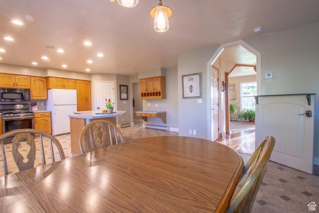 560 N 400 W, Smithfield, UT 84335 - dining room with a baseboard radiator, a baseboard heating unit, light tile patterned floors, baseboards, and recessed lighting