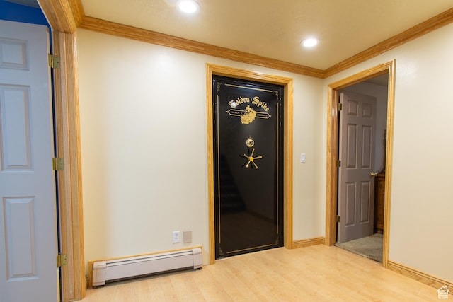 560 N 400 W, Smithfield, UT 84335 - hallway featuring a baseboard heating unit, baseboards, recessed lighting, wood finished floors, and crown molding