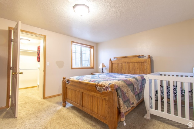 560 N 400 W, Smithfield, UT 84335 - bedroom with light colored carpet, baseboards, and a textured ceiling