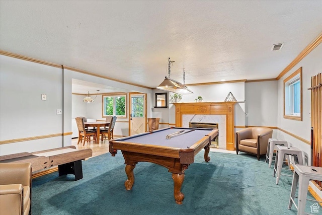 game room with carpet, ornamental molding, a textured ceiling, a fireplace, and pool table