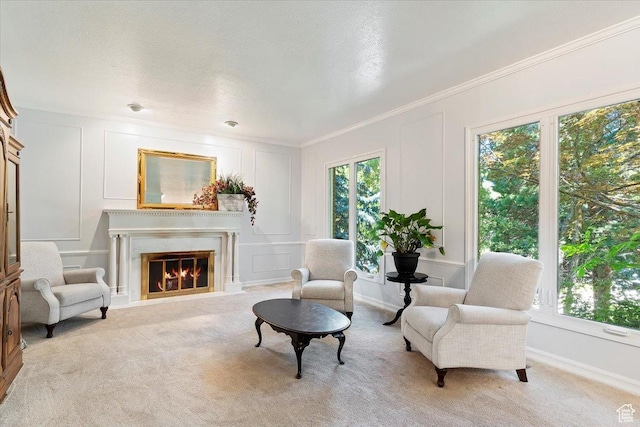 living area with light carpet and ornamental molding