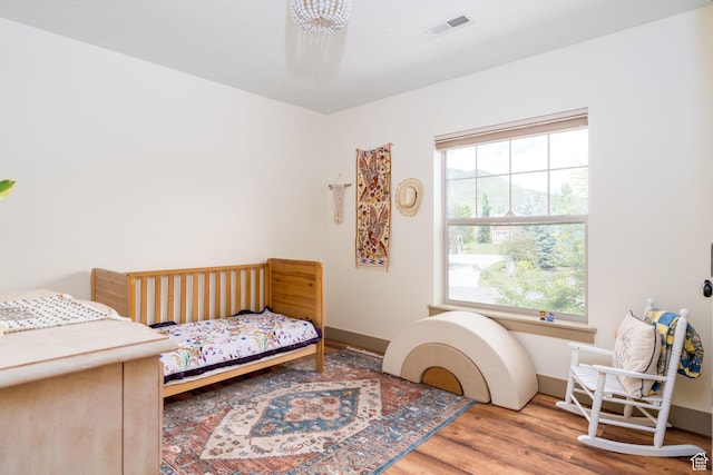 bedroom featuring hardwood / wood-style flooring