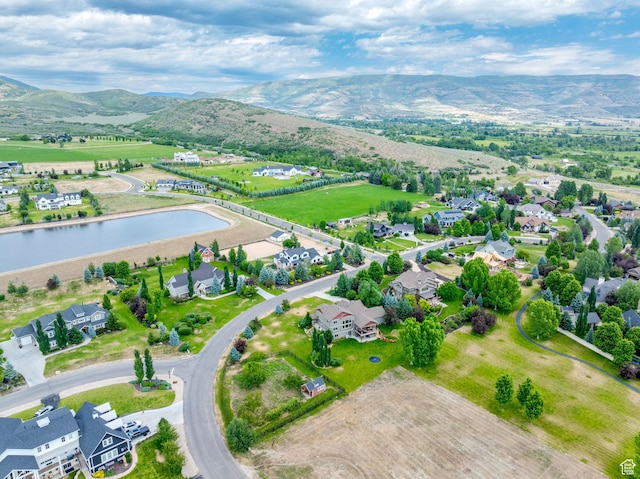 bird's eye view featuring a water and mountain view