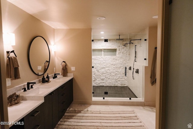 bathroom with vanity and a shower with door