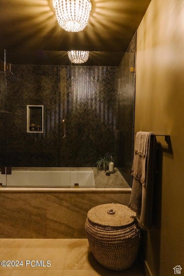 bathroom with a chandelier