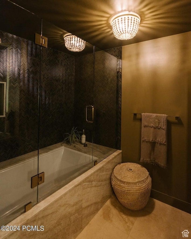 bathroom featuring shower with separate bathtub