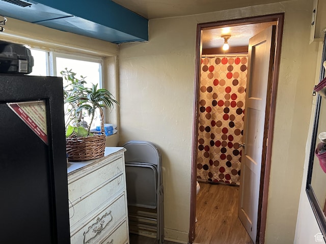 736 E Hatchery Rd, Bicknell, UT 84715 - laundry room with wood finished floors and visible vents