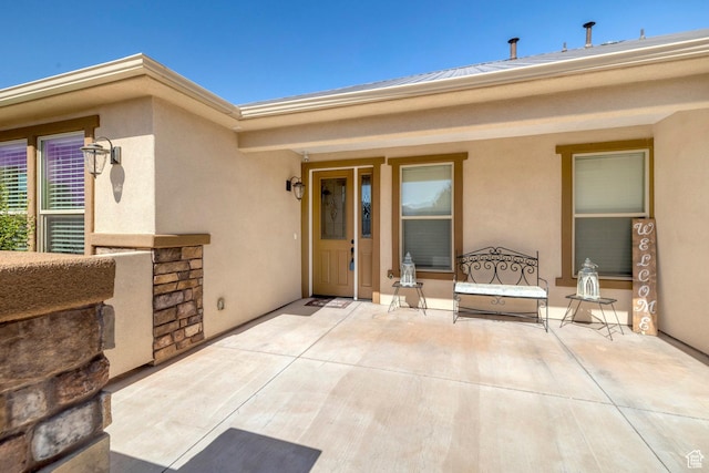 1536 S Cliff Dr, Apple Valley, UT 84737 - view of exterior entry featuring a patio