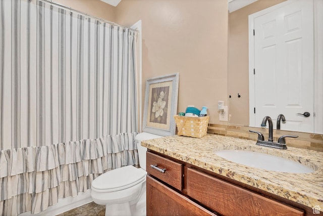 1536 S Cliff Dr, Apple Valley, UT 84737 - full bathroom featuring shower / bath combo with shower curtain, tile patterned floors, toilet, and vanity