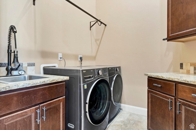 1536 S Cliff Dr, Apple Valley, UT 84737 - washroom with sink, independent washer and dryer, and cabinets