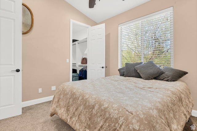 1536 S Cliff Dr, Apple Valley, UT 84737 - bedroom featuring ceiling fan, carpet, vaulted ceiling, a walk in closet, and a closet