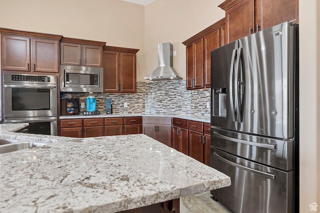 1536 S Cliff Dr, Apple Valley, UT 84737 - kitchen with wall chimney exhaust hood, stainless steel appliances, tasteful backsplash, sink, and light stone counters
