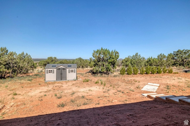1536 S Cliff Dr, Apple Valley, UT 84737 - view of yard with a rural view and a shed