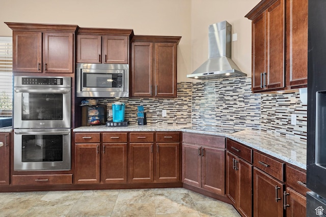 1536 S Cliff Dr, Apple Valley, UT 84737 - kitchen with decorative backsplash, wall chimney range hood, light stone counters, and stainless steel appliances