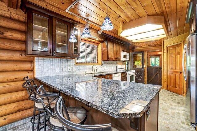 11996 S 3600 W, Riverton, UT 84065 - kitchen with wooden ceiling, a peninsula, white appliances, a sink, and decorative backsplash