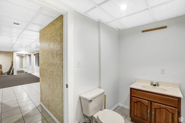 11996 S 3600 W, Riverton, UT 84065 - bathroom featuring a paneled ceiling, toilet, vanity, tile patterned flooring, and baseboards